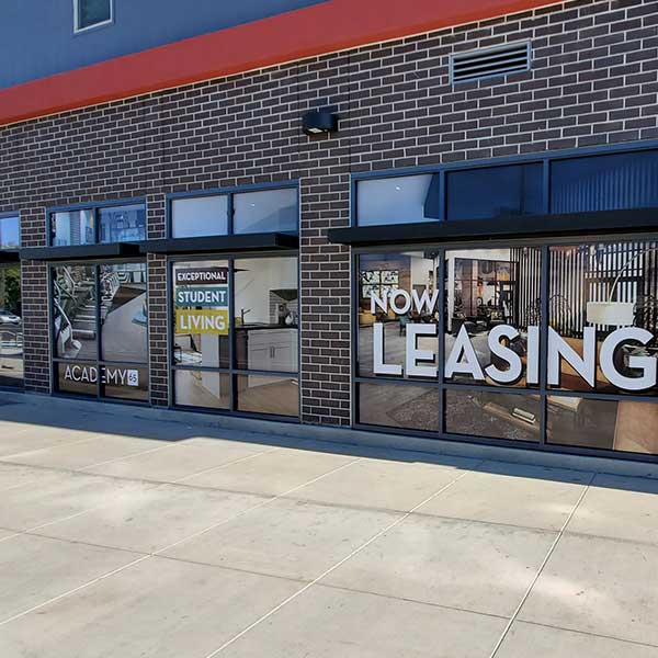 Academy 65 window graphics installation in Sacramento