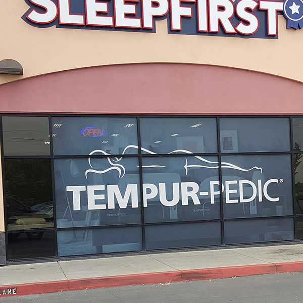 Perforated window graphics on a storefront
